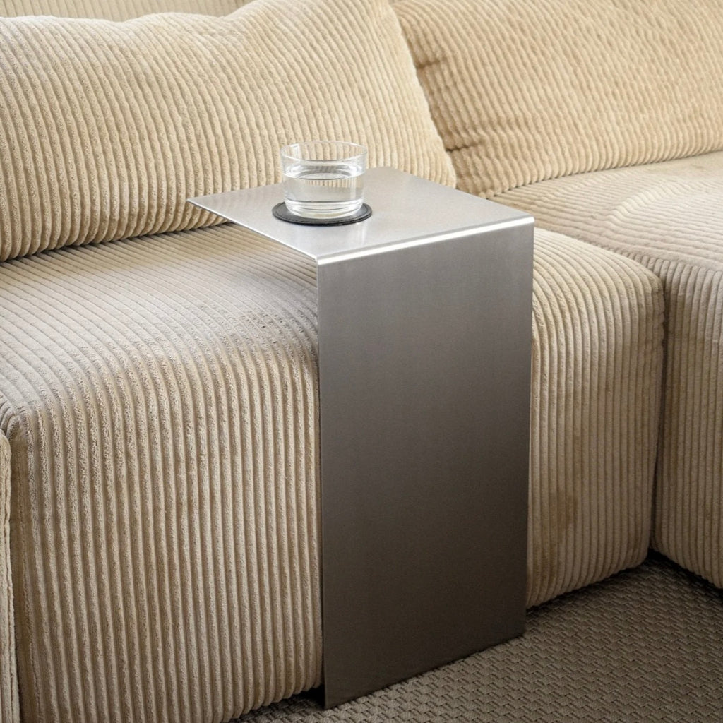 Monolith steel side table with bold minimal design, precision-cut metal construction, industrial bedside table for modern living room or bedroom