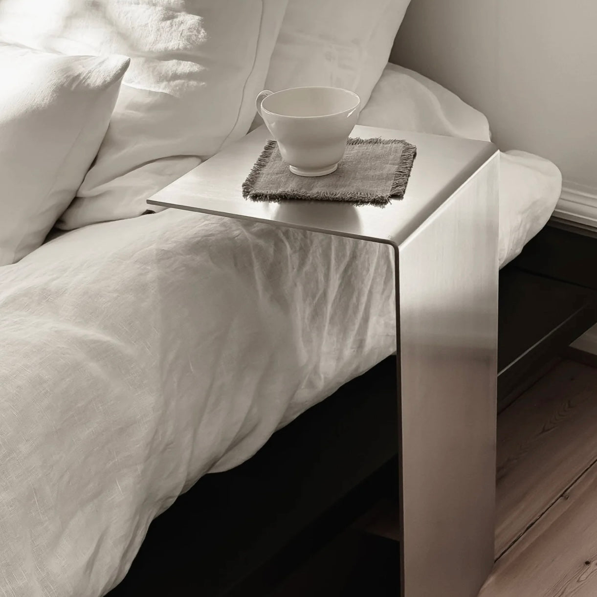 Monolith steel side table with bold minimal design, precision-cut metal construction, industrial bedside table for modern living room or bedroom