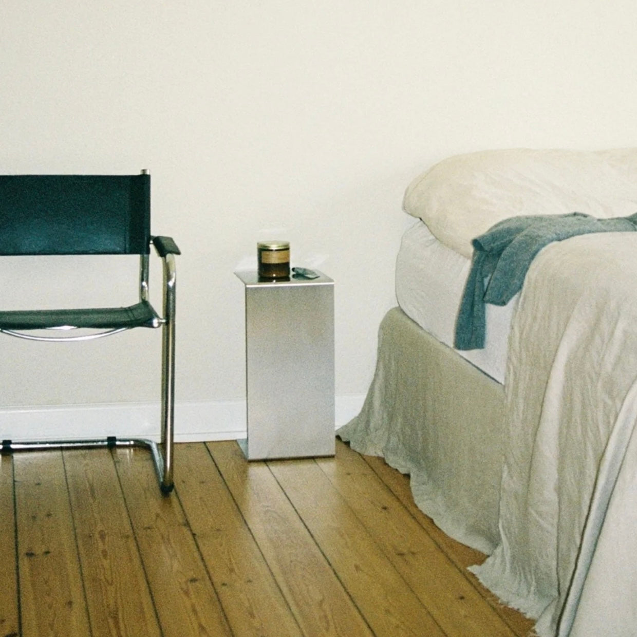 Monolith steel side table with bold minimal design, precision-cut metal construction, industrial bedside table for modern living room or bedroom