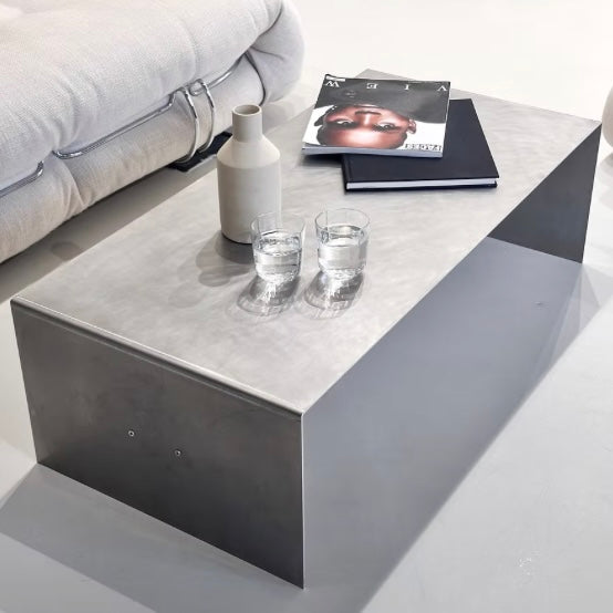 Monolith steel coffee table with bold minimal design, precision-cut metal construction, industrial center table for modern living room