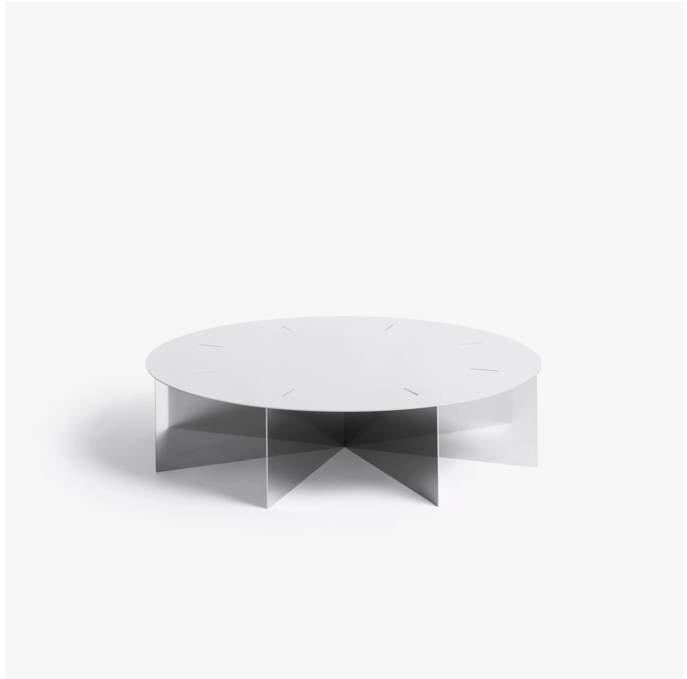 Radial steel coffee table with round top and geometric base design, precision-cut metal construction, minimal industrial center table for living room