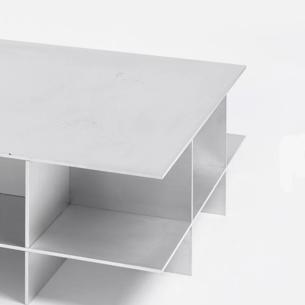 Metal grid coffee table with structured steel lattice design, precision-cut construction, industrial modern center table for living room