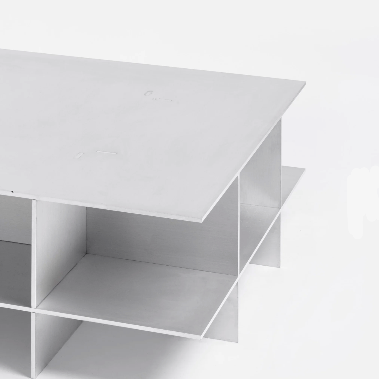 Metal grid coffee table with structured steel lattice design, precision-cut construction, industrial modern center table for living room