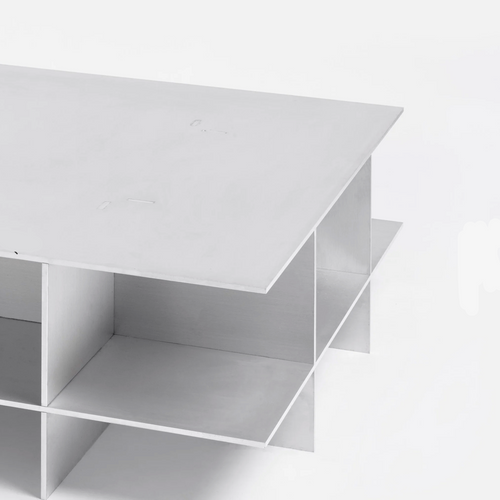 Metal grid coffee table with structured steel lattice design, precision-cut construction, industrial modern center table for living room