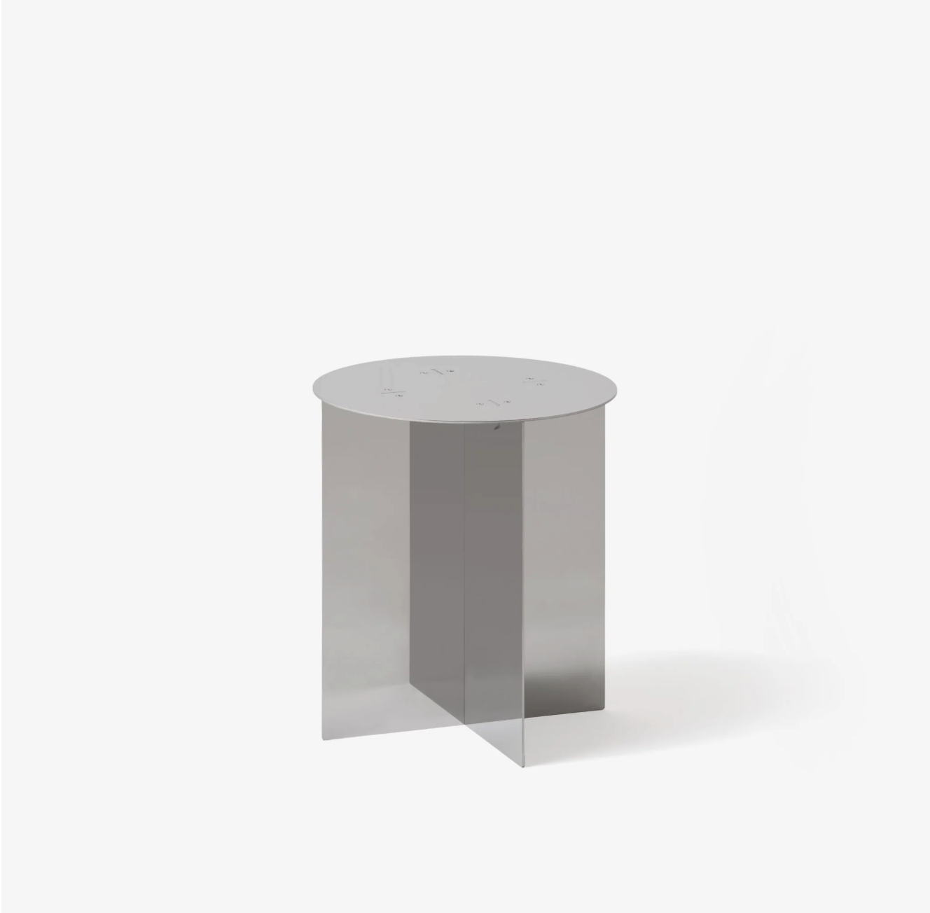 Round radial steel side table with geometric base design, minimal industrial look, precision-cut metal construction, modern side table for living room or bedroom
