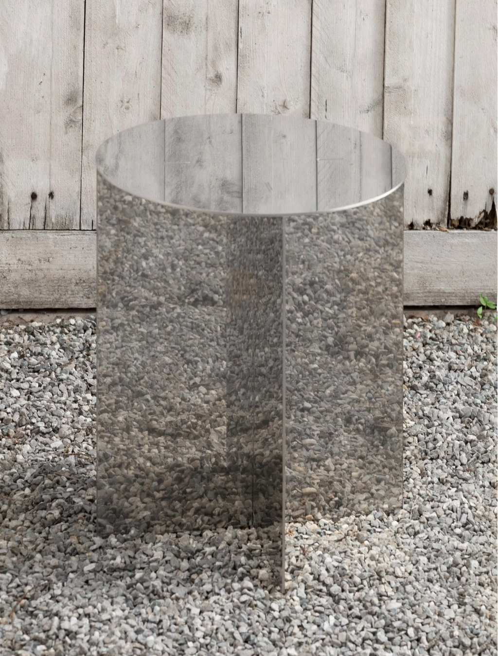 Round radial steel side table with geometric base design, minimal industrial look, precision-cut metal construction, modern side table for living room or bedroom
